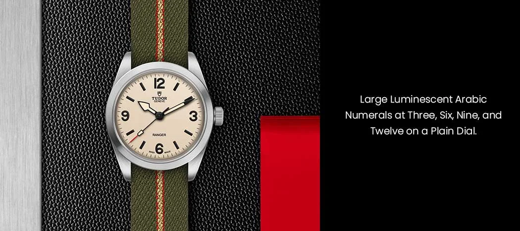 large luminescent Arabic numerals at three, six, nine, and twelve, and uniquely designed hands set upon a plain dial.