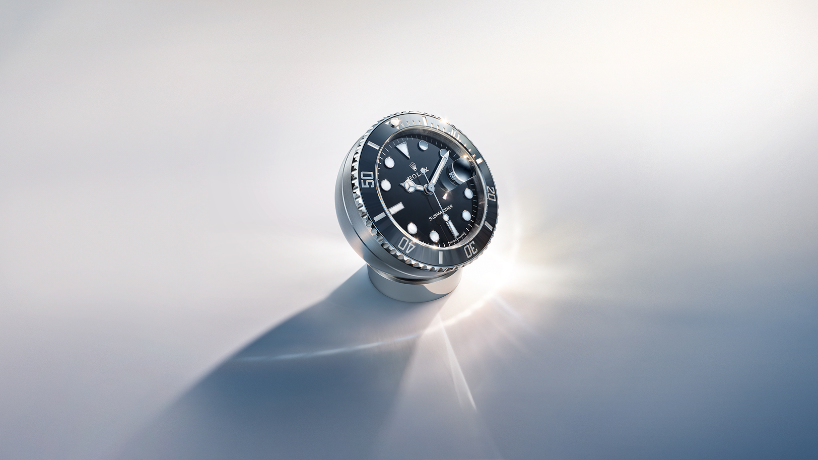 Rolex desk clock with Chromalight display that emits an intense blue glow in the dark.